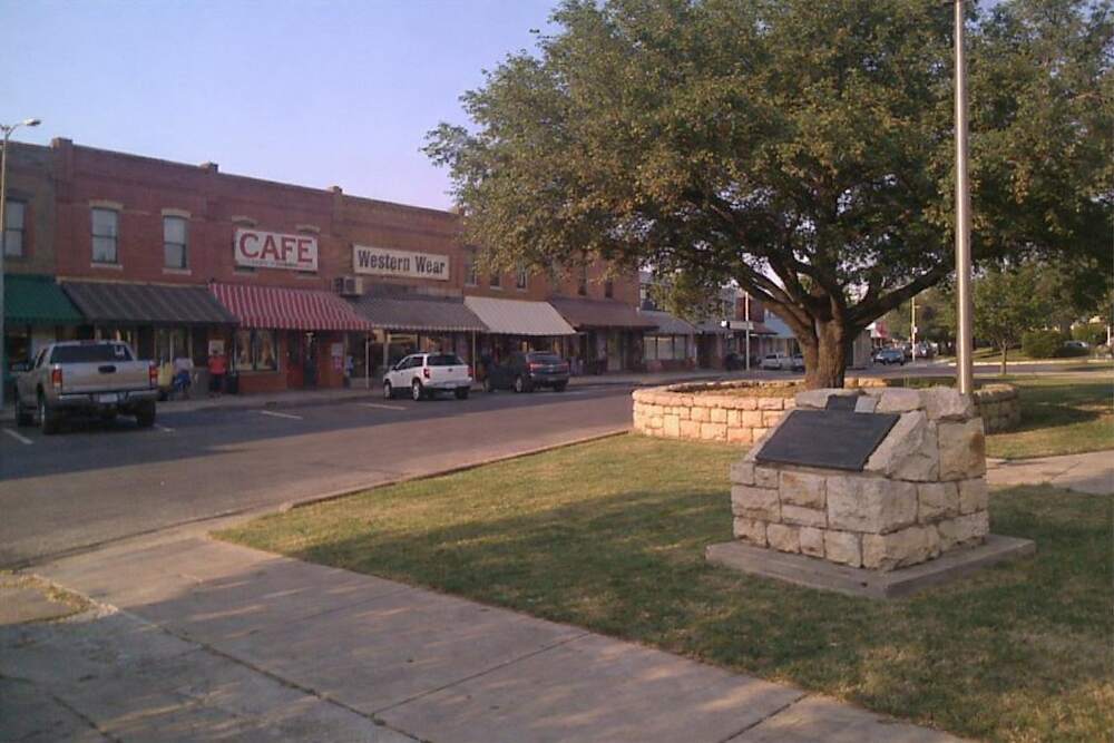 A small-town courthouse square with brick buildings