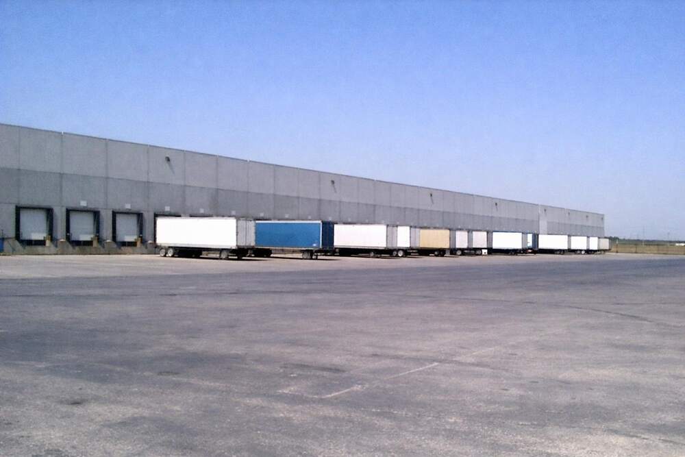 A row of warehouse buildings with dock doors
